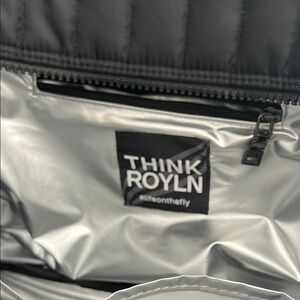 THINK ROYLN Silver Interior with Black Trim and Label